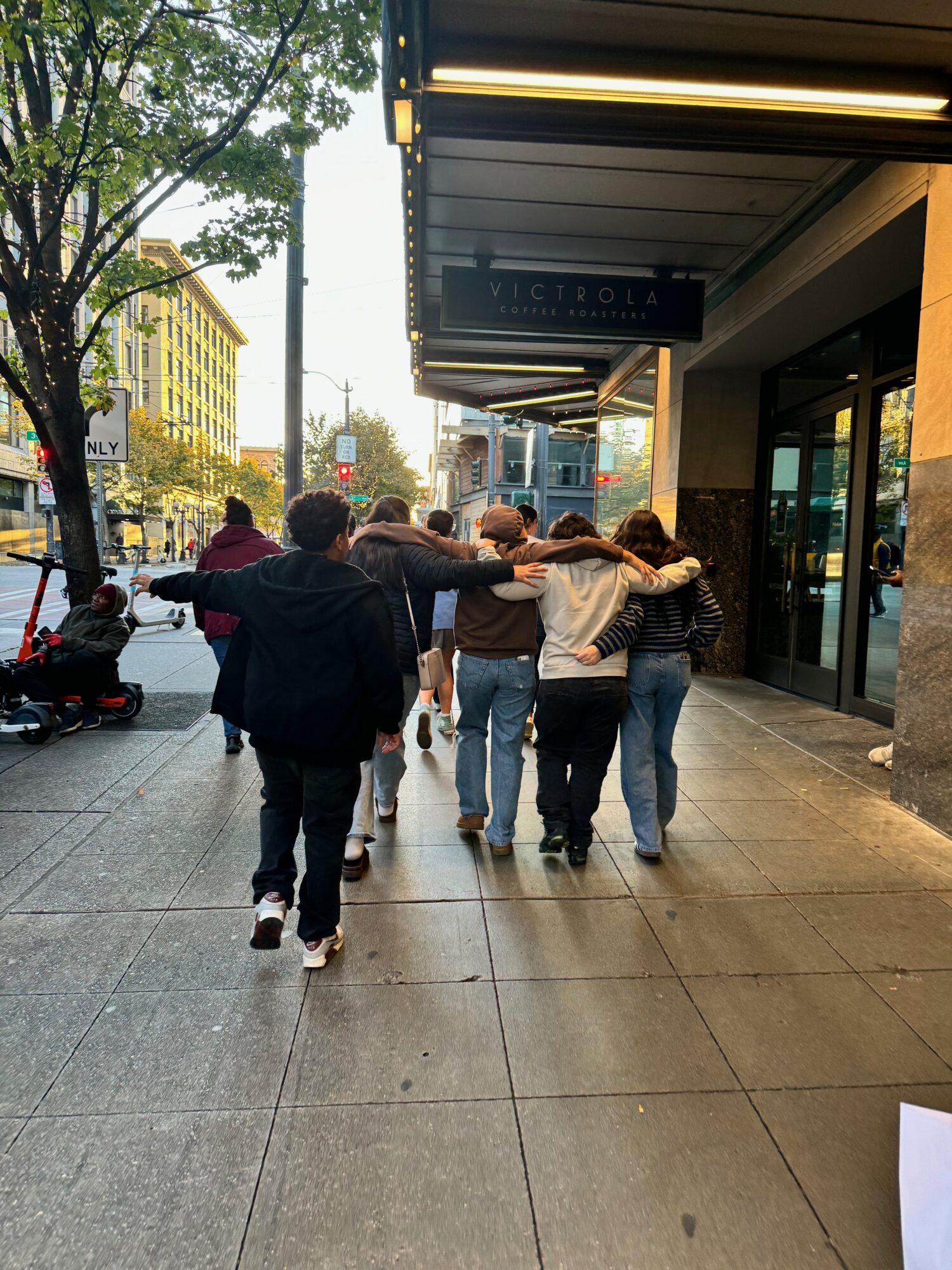 Group walking together on city sidewalk
