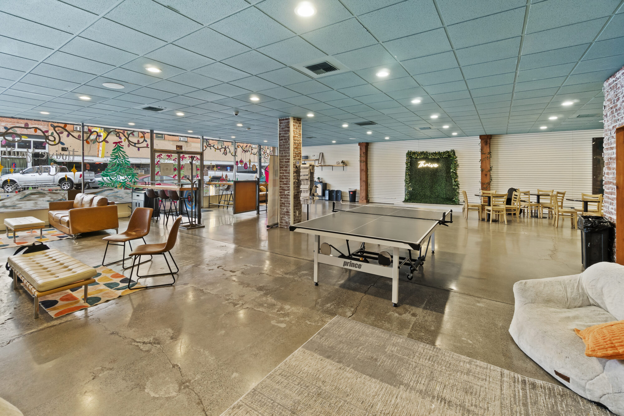 Open lounge area with ping pong table and seating.