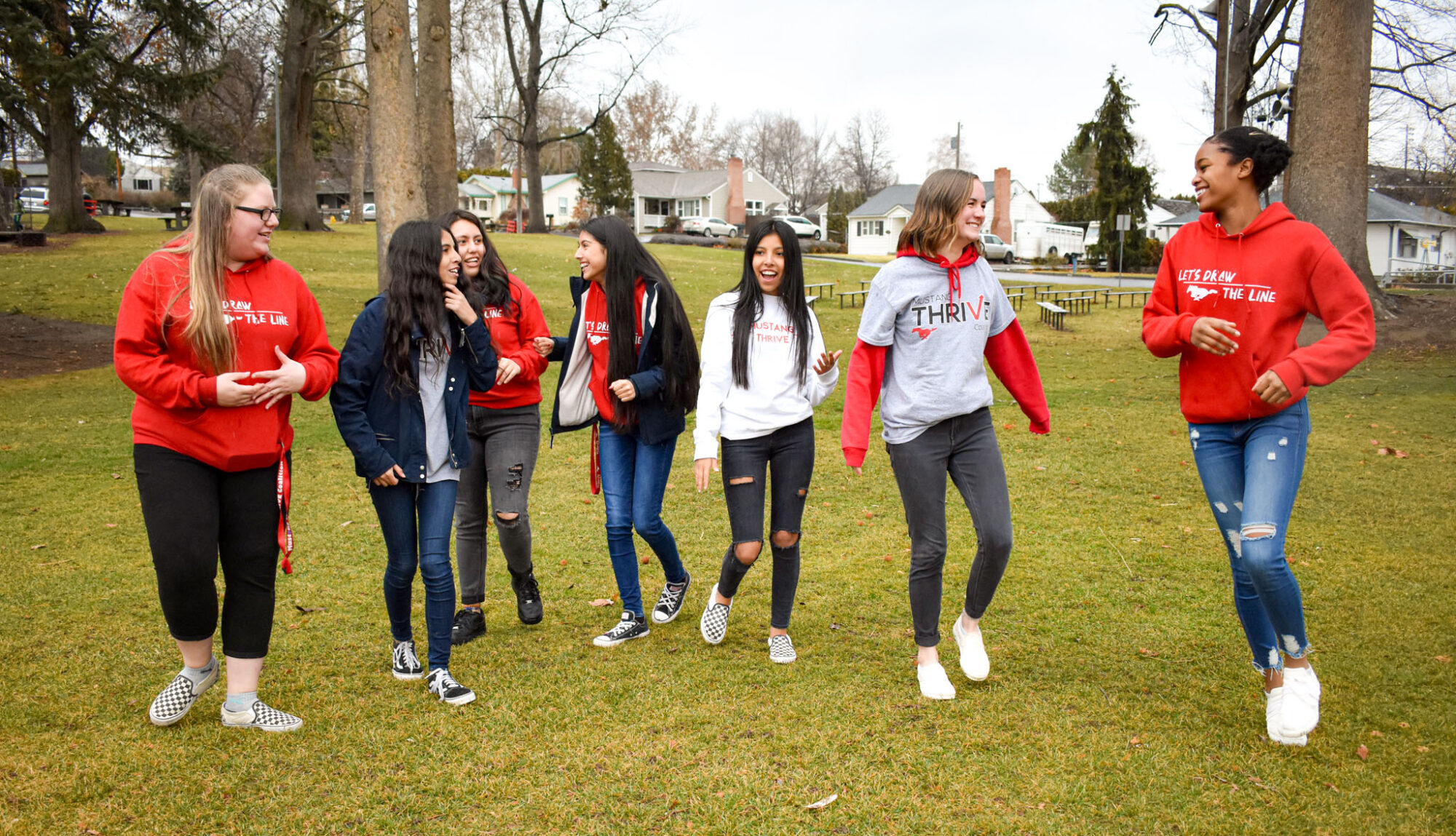 Group of friends walking in a park